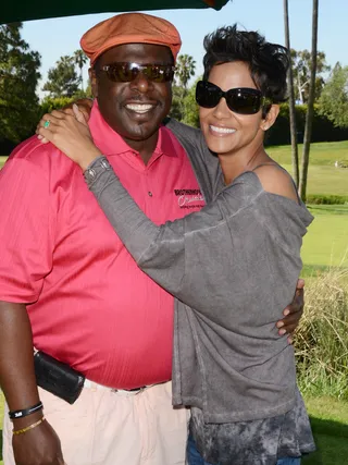 Hitting the Greens - Halle Berry gives her old friend&nbsp;Cedric the Entertainer a big hug at her 4th Annual Halle Berry Celebrity Golf Classic held at the Wilshire Country Club in Los Angeles. The event raises money to support families that are victims of domestic violence.   (Photo: FayesVision/WENN.com)