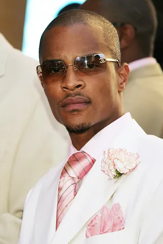 T.I. - The rapper shows up on the red carpet in a dapper suit with pretty-in-pink accents.(Photo: Jeffrey Mayer/WireImage.com/Getty Images)