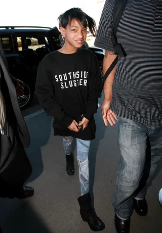 Willow Smith - Willow jazzed up her sweatshirt with patterned tights and funky flat boots. We hope her leather jacket is close by to keep her warm for a red eye flight and cool after touchdown.   (Photo: BJJ/FameFlynet Pictures
