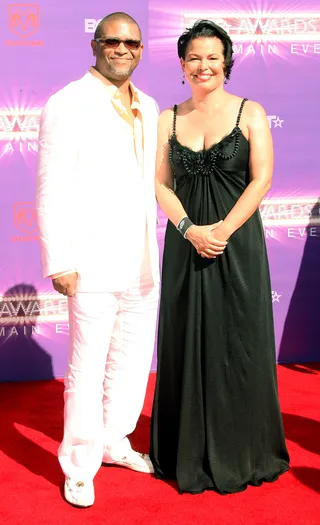 Reginald Hudlin and Debra L. Lee&nbsp; - BET's President and the CEO and Chairman look glamorously coordinated in simple colors and lines.&nbsp; (Photo: Frederick M. Brown/Getty Images)