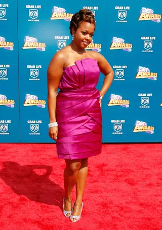Chrisette Michele&nbsp; - The singer with the sweet soprano voice looks charming in her pink crumb catcher.(Photo: Frazer Harrison/Getty Images)