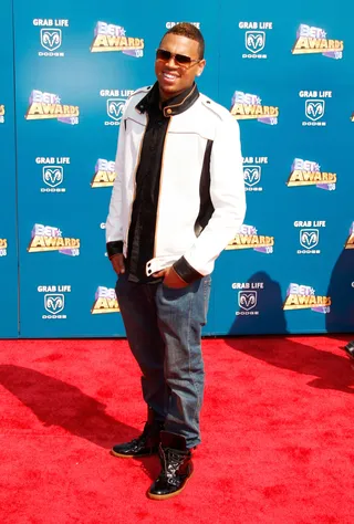 Chris Brown - Cool in patent-leather kicks, the pop star keeps it simple in black and white. (Photo: Frazer Harrison/Getty Images)