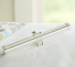 Silver Birth Certificate Holder - This elegant silver birth certificate holder from Pottery Barn is a functional keepsake that can be personalized with your baby’s name and then propped on their bedroom dresser. How sweet is that?  (Photo: Pottery Barn)