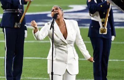 Angelic In All White&nbsp; - While the 2021 Super Bowl surely didn’t look like the years’ prior, Jazmine still came to slay. She belted it out in a killer white suit by Area with a head-turning diamond head dress.&nbsp;&nbsp; (Photo: Getty Images)