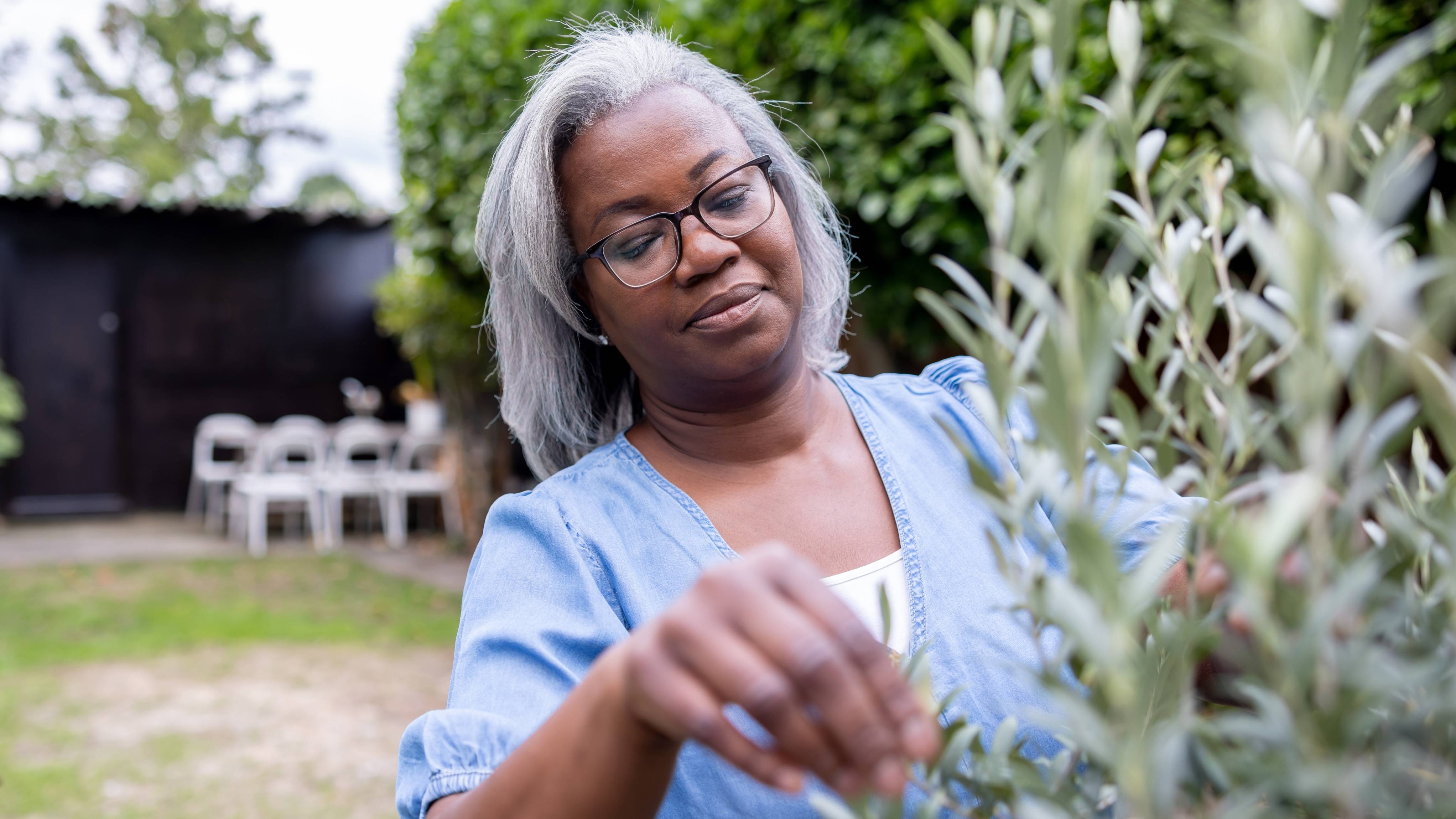 Black mature woman in the garden. 