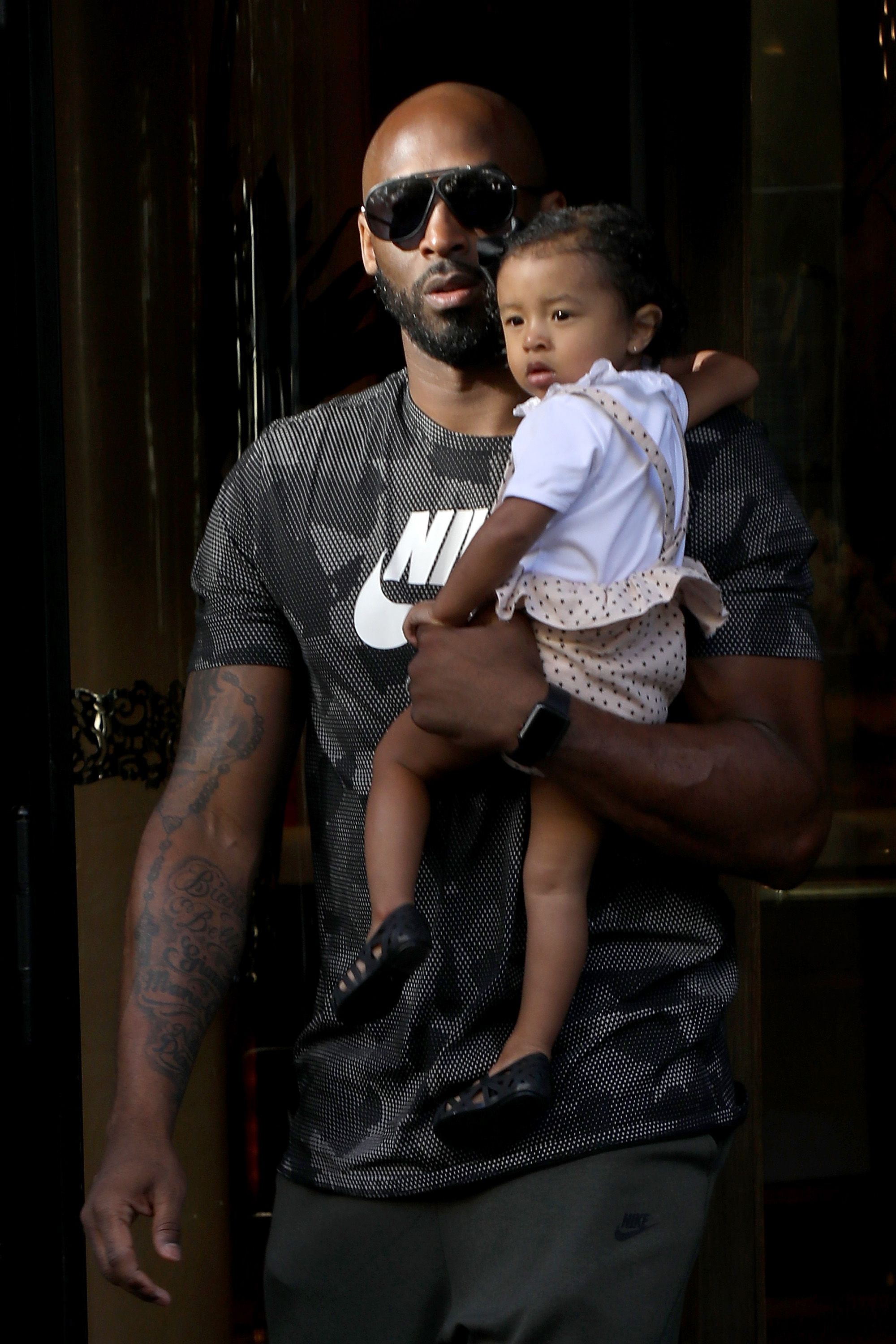 Kobe Bryant and Bianka Bella - How sweet! Kobe Bryant holds his youngest daughter, Bianka Bella, close to his heart as they leave their hotel in Paris.&nbsp;(Photo: Pierre Suu/GC Images)