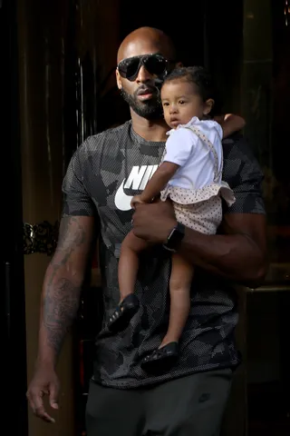 Kobe Bryant and Bianka Bella - How sweet! Kobe Bryant holds his youngest daughter, Bianka Bella, close to his heart as they leave their hotel in Paris.&nbsp;(Photo: Pierre Suu/GC Images)