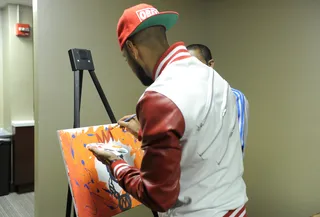 I Got This - Swizz Beatz adds his touch to a painting started by John Reed of BET.com in the green room at 106 &amp; Park, May 8, 2012. (Photo: John Ricard / BET)