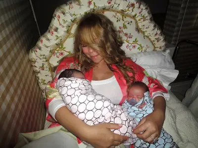 Mariah Carey, Monroe and Moroccan - Here's a photo of Mariah Carey sharing sweet dreams with her twins Monroe and Moroccan Cannon, who just turned a year right before their parents' fourth wedding anniversary. Nick and Mariah still look as though they're in newlywed bliss.  (Photo: Fresh Air Fund/WireImage)