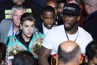 Money Posse - Justin Bieber and Curtis &quot;50 Cent&quot; Jackson enter the ring with Mayweather.(Photo: Al Bello/Getty Images)