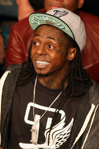 Taking in the Action - Rapper Lil Wayne watches the fight.(Photo: Al Bello/Getty Images)
