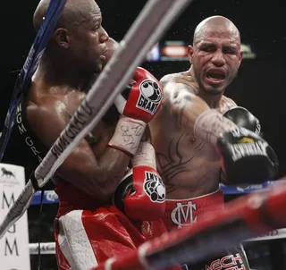 On the Ropes - A ferocious Cotto throws a string of punches against Mayweather in the seventh round. AP&nbsp;stats showed Mayweather landing 179 of 687 punches to 105 of 506 to Cotto.(Photo: AP Photo/Eric Jamison)