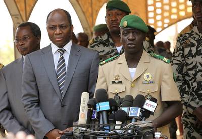 Mali Coup Leader Revokes, Then Reinstates Constitution  - Within just one week, the leader of a military coup in Mali proffered a new constitution and later, under international pressure to hand over power, reinstated the original constitution and government institutions. Also, Alassane Ouattara, current head of West African regional body ECOWAS, said the body had closed borders to trade and frozen Mali's access to bank accounts.(Photo: REUTERS/Luc Gnago)