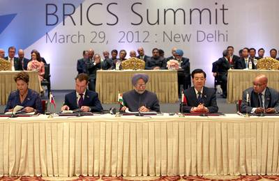 BRICS Nations Band Together for Change - Leaders from Brazil, Russia, India, China and South Africa, aka BRICS, five of the world’s emerging economic powers, met last week in New Delhi for a one-day summit to discuss mutual trade interests, pressure Western nations for international monetary reforms and call for an end to the violence in Syria.(Photo: Naveen Jora/India Today Group/Getty Images)