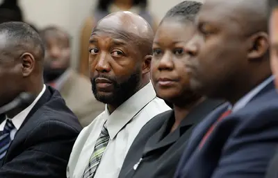 Taking a Stand on Racial Profiling - Flanked by legal counsel, Tracy Martin and Sybrina Fulton listen to witnesses testify about the effect of &quot;Stand Your Ground&quot; laws and overzealous neighborhood watch groups. &quot;We truly believe that Trayvon Martin is dead today because he was racially profiled,&quot; attorney Benjamin Crump said.(Photo: Chip Somodevilla/Getty Images)