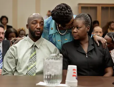 Lawmakers Lend Support to Grieving Parents - Texas Rep. Sheila Jackson Lee offers comfort to Trayvon Martin's parents.(Photo: Chip Somodevilla/Getty Images)