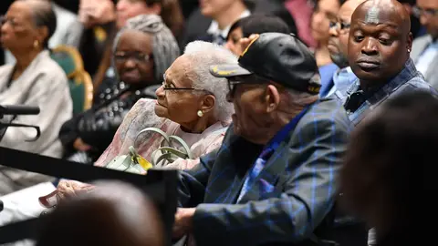 Tulsa race massacre Survivors Viola Fletcher (C)  and Hughes Van Ellis (C R) listen to US President Joe Biden as he speaks on the 100th anniversary of the Tulsa Race Massacre at the Greenwood Cultural Center in Tulsa, Oklahoma on June 1, 2021. - US President Joe Biden traveled Tuesday to Oklahoma to honor the victims of a 1921 racial massacre in the city of Tulsa, where African American residents are hoping he will hear their call for financial reparations 100 years on. (Photo by MANDEL NGAN / AFP) (Photo by MANDEL NGAN/AFP via Getty Images)