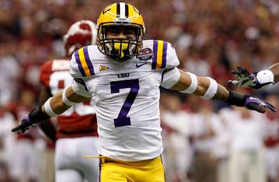 Honey Badger Returns to LSU…for Class - Former Louisiana State University football player Tyrann &quot;Honey Badger&quot; Mathieu won't be seen on the field this season, but has decided to stay enrolled at the university to attend classes. The Heisman Trophy finalist was kicked off the football team last month after repeatedly testing positive for drugs. Mathieu will reportedly finish the semester at LSU and may enter the 2013 NFL draft in the spring.&nbsp;(Photo: Chris Graythen/Getty Images)