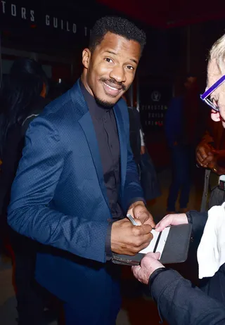 Premiere Day - Nate Parker signed autographs for fans as he left a screening and panel for the movie Birth of a Nation at the Directors Guild Theater in New York. (Photo: Darla Khazei, PacificCoastNews)