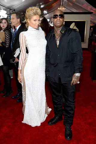 Bird 'n' Paris – January 2014 - Many were surprised that Young Money signed Paris Hilton to their label. However, anyone that's been paying attention to celebrity news will know that Paris has been raking in millions as a DJ. Of course, the ever-enterprising Birdman knew her talent and has been helping her achieve even more fame. He even took her to the Grammys. (Photo: Larry Busacca/WireImage)