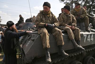 Three Dead - Major chaos continued in eastern Ukraine as three pro-Russia activists died after about 300 individuals attacked a National Guard base on April 17. President Putin accused Ukraine of committing a &quot;serious crime,&quot; while President Obama alluded to more sanctions against Russia's alleged involvement in the uprisings.&nbsp;(Photo: AP Photo/Sergei Grits)