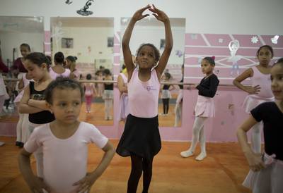 Ballet in Brazil - Every year, dozens of disadvantaged girls and boys from the slums of Brazil are selected to participate in a prestigious dance workshop led by a respected Brazilian ballerina. Keep reading to learn about this inspiring initiative and its significance to the young girls.&nbsp;? Patrice Peck(Photo: AP Photo/Andre Penner)