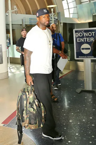 From East to West - 50 Cent&nbsp;arrives at LAX representing the New York Yankees in a fitted cap.(Photo: Cathy Gibson, PacificCoastNews)