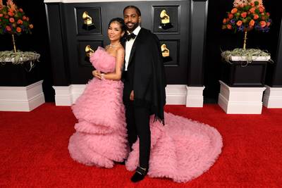 Jhené Aiko and Big Sean - Jhené Aiko and Big Sean showed a bit of PDA on the red carpet of the 63rd Annual Grammy Awards. Rocking a tailored Zegna suit with a matching black cape, Sean seemed very attentive to his bae, who bedazzled in an elaborate pink gown.&nbsp; (Photo by Kevin Mazur/Getty Images for The Recording Academy )