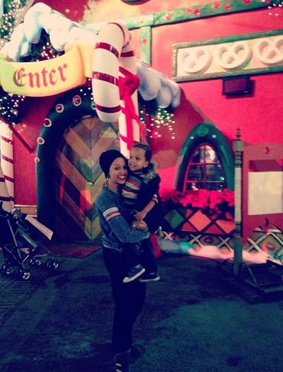 Tia Mowry - The actress pauses for a snuggle with her sweet mini-me, son Cree, before checking out Santa’s Workshop.  (Photo: Tia Mowry via Instagram)