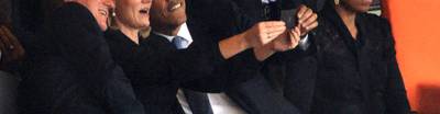 /content/dam/betcom/images/2013/12/National-12-01-12-15/121013-national-barack-obama-takes-selfie.jpg