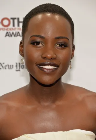 Lupita Nyong’o  - The 12 Years a Slave star amps up her beauty look with a sexy dark lip. Take note and let your next poppin' lip color stand out as your main accessory.  (Photo:&nbsp;Theo Wargo/Getty Images for IFP)