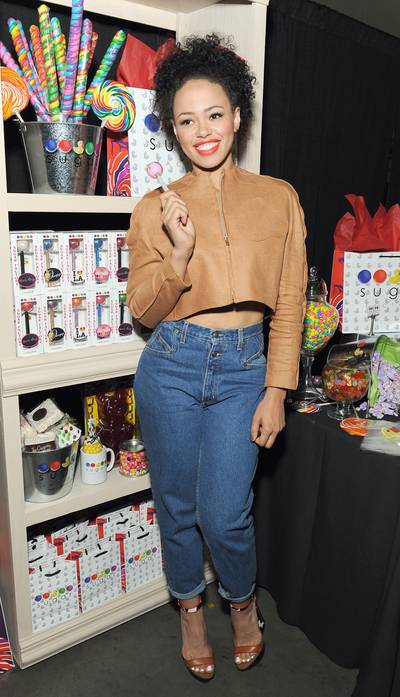 Sugar Mama&nbsp; - Singer-songwriter Elle Varner shows off her best smile and calms her sweet tooth with a Sugar lolipop at the event. (Photo: Angela Weiss/BET/Getty Images for BET)