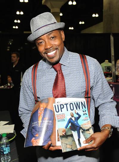 Feature Ready - Filmmaker and producer William Packer holds up a recent issue of Uptown magazine featuring himself. 2014 has been a big year for Packer, whose latest films About Last Night andThink Like a Man Too&nbsp;were both box office hits. (Photo: Angela Weiss/BET/Getty Images for BET)
