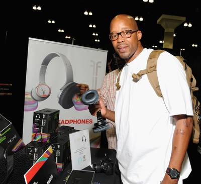 Adding to the Stash - We're sure rap O.G. Warren G has a nice collection of headphones for his listening pleasure, but he can now enjoy a fresh new pair courtesy of Flips Audio.&nbsp;(Photo: Angela Weiss/BET/Getty Images for BET)