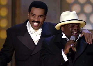 The Hosts With the Most - Funny men and co-hosts Steve Harvey and Cedric "The Entertainer" share a laugh during the first BET Awards in 2001. (Photo by M. Caulfield/WireImage)