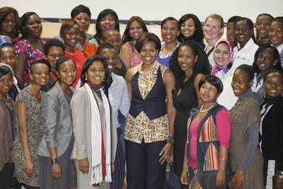 Dateline: Johannesburg, June 22, 2011 - The first lady poses with young women leaders during a visit to the Apartheid Museum in Johannesburg, South Africa. (Photo: Charles Dharapak/AP Photo, Pool)