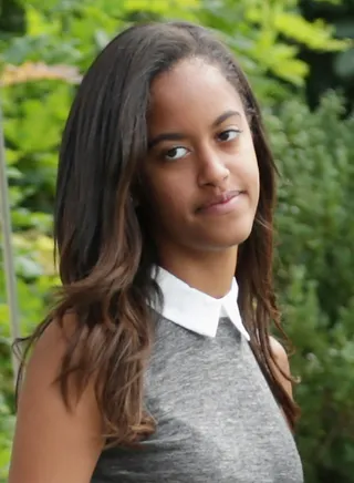 Malia Obama  - Oh how Malia is growing up to be such a beautiful young lady. Makeup is minimal and that hair is always laid. She must get it from her mama.(Photo: Chip Somodevilla/Getty Images)