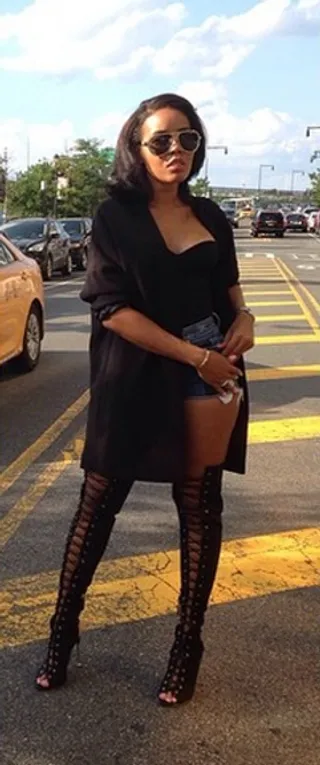 Angela Simmons&nbsp; - The AngelaIAm designer hits us with her street chic ensemble in N.Y.C. Everything from the short-shorts to the lace-up thigh-high booties screams sassy!  (Photo: Angela Simmons via Instagram)