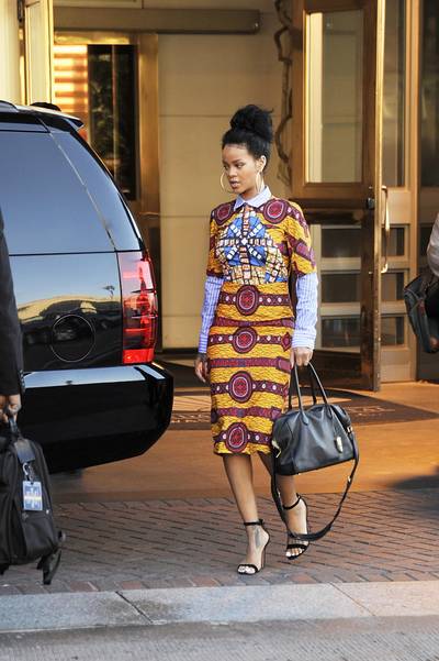 Pattern Mix - Rihanna looks gorgeous in a colorful Stella Jean African print dress and striped button down as she heads to the White House for her performance at the Concert for Valor in honor of Veterans Day.(Photo: Gene Young/Splash News)