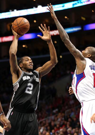 Spurs Outlast Clippers - Kawhi Leonard has been experiencing blurry vision during a bout with an eye infection early this season. But the NBA Finals MVP was seeing the basket just fine Monday night, leading the defending champion San Antonio Spurs to an 89-85 win over the Los Angeles Clippers by notching 26 points, 10 rebounds and three steals, including crucial takeaways from Chris Paul and Jamal Crawford.&nbsp;(Photo: Stephen Dunn/Getty Images)