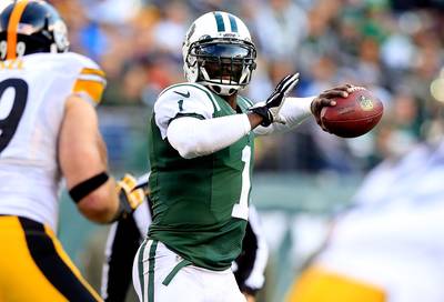 Michael Vick Leads Jets in Upset of Steelers - Michael Vick turned back the hands of time and looked the young quarterback who once dominated the NFL on Sunday. The veteran QB threw two touchdowns to lead the New York Jets to a surprising 20-13 home victory over the Pittsburgh Steelers (6-4), snapping the Jets (2-8) eight-game skid. Meanwhile, Steelers quarterback Ben Roethlisberger, who had thrown an NFL-record 12 touchdowns in the prior two games, was held to one TD strike, while tossing two interceptions.(Photo: Alex Trautwig/Getty Images)