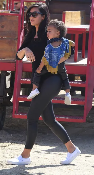Casual Encounters - The two beauties step out at Mr. Bones Pumpkin Patch in Los Angeles in coordinating black leather leggings and white Vans slip-ons. The real treat is clearly Nori’s fun fringed poncho!(Photo: INFphoto.com)