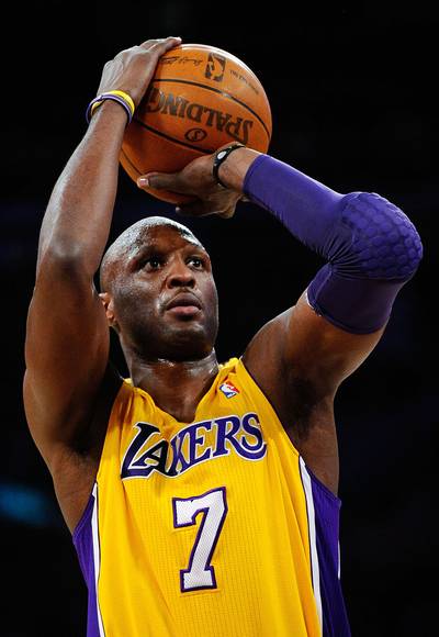 Traded to the Lakers - Odom was traded to the Lakers in 2004, after his season with Miami. In his first year on the West Coast, he incurred a shoulder injury which forced him to miss the second half of the season, but that same year Odom helped the U.S. men’s basketball team take home the bronze medal at the 2004 Olympics in Athens.(Photo: Kevork Djansezian/Getty Images)