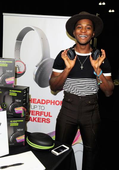 Music Lover - Roman GianArthur tests out the powerful speakers of Flips headphones. The soulful singer is an artist under Janelle Monáe's Wondaland Arts Society.&nbsp;(Photo: Amy Graves/BET/Getty Images for BET)