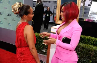 Best Hair  - Singer and reality star K. Michelle worked it out on the red carpet in a revealing and fun pink tuxedo and fresh, fun red hair.   (Photo: John Ricard/Getty Images for BET)