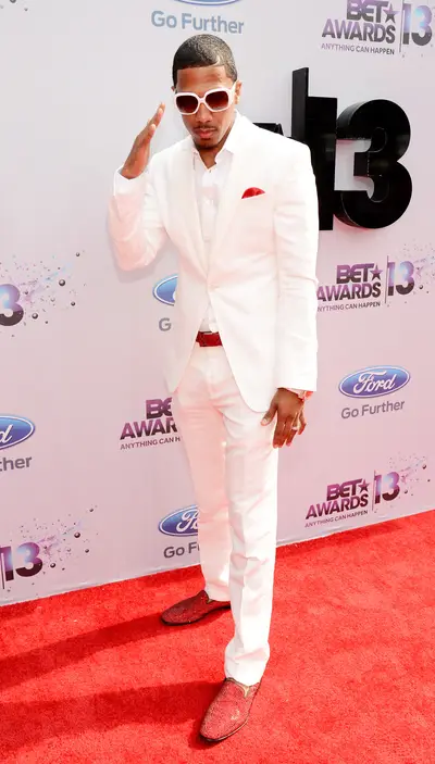 Mr. Carey - Nick Cannon wears all white with pops of color in his pocket square, animal-skin shoes and belt on the Ford Red Carpet at the 2013 BET Awards.  (Photo: Kevin Mazur/BET/Getty Images for BET)
