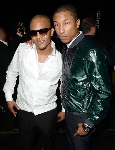 Where's Robin? - &quot;Blurred Lines&quot; collaborators T.I. and Pharrell look ready to pop champagne backstage.  (Photo: Jason Merritt/Getty Images for BET)