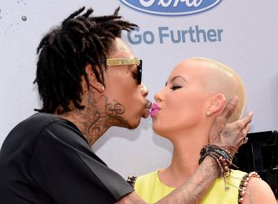 Beauty &amp; the Bad Boy - New parents Amber Rose and Wiz Khalifa, who welcomed son Sebastian Taylor Thomaz in February, show some love on the red carpet.  (Photo:&nbsp; Kevin Mazur/BET/Getty Images for BET)