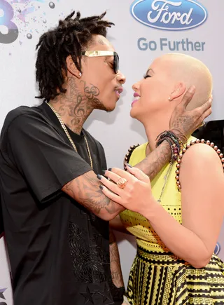 Parents' Night Off - Having a baby didn't cramp their style or their serious PDA. They snuck in a long kiss while posing on the carpet for this year's BET Awards.  (Photo: Kevin Mazur/BET/Getty Images for BET)