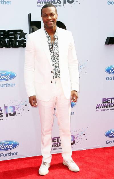 Crisp - Our 2013 BET Awards host Chris Tucker wears a white suit jacket and slacks with a paisley button down.  (Photo: Frederick M. Brown/Getty Images for BET)